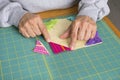 Quilter creating a quilt block for a quilt for children. Royalty Free Stock Photo