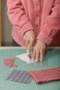 Quilter cutting fabric Royalty Free Stock Photo