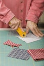 Quilter cutting fabric