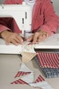 Quilter sewing pieces of fabric.