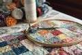 quilting hoop, needle, and thread with a variety of fabrics Royalty Free Stock Photo