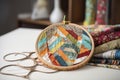 quilting hoop, needle, and thread with a variety of fabrics Royalty Free Stock Photo