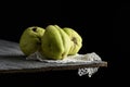 Quince fruits on a wooden table