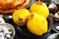 Quinces, flat bread and salty apricot pits in oriental way Royalty Free Stock Photo