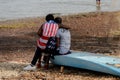 Unidentified local couple sit on the coast of the Atlantic ocea