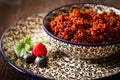 Quinoa blueberries and raspberries on a plate with black backgro Royalty Free Stock Photo