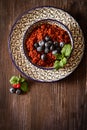 Quinoa blueberries and raspberries on a plate with black backgro Royalty Free Stock Photo