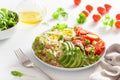 Quinoa with boiled egg, avocado, tomato, arugula. healthy breakfast