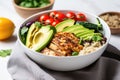 quinoa bowl with grilled chicken pieces and avocado slices