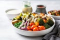 quinoa bowl with roasted vegetables and dressing on side