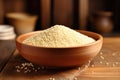 Quinoa in bowl on wooden kitchen table Royalty Free Stock Photo