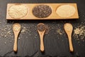 Quinoa, chia and amarantus seeds in wooden spoons