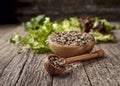 Quinoa with Green salad on wooden background