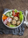 Quinoa meatballs and vegetable salad. Buddha bowl on a wooden table. Healthy, diet, vegetarian concept. Royalty Free Stock Photo