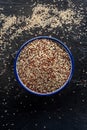 Quinoa mix. Mixed white, red and black quinoa seeds in a bowl Royalty Free Stock Photo