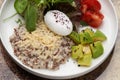 Quinoa porridge breakfast with oatmeal, poached egg Royalty Free Stock Photo