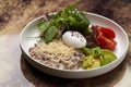 Quinoa porridge breakfast with oatmeal, poached egg Royalty Free Stock Photo