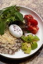 Quinoa porridge breakfast with oatmeal  poached egg Royalty Free Stock Photo