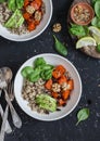 Quinoa and pumpkin bowl. Vegetarian, healthy, diet food. On a dark background