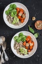 Quinoa and pumpkin bowl. Vegetarian, healthy, diet food. On a dark background