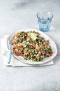 Quinoa Quinua salad with tomatoes and herbs in white bowl Royalty Free Stock Photo