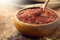 Quinoa. Red, black and white quinoa grains in a wooden bowl. Healthy food. Chenopodium quinoa Royalty Free Stock Photo