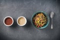 Quinoa salad bowl with colorful vegetables: green beans, carrot, corn, bell pepper, peas and two cups with red and white quinoa se Royalty Free Stock Photo