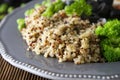 Quinoa salad with green pea,broccoli, olives. Healthy food, lunch over wooden background. Vegetarian food, snack Royalty Free Stock Photo