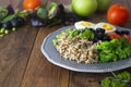 Quinoa salad with green pea,broccoli, olives. Healthy food, lunch over wooden background. Vegetarian food, snack Royalty Free Stock Photo