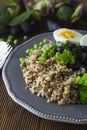 Quinoa salad with green pea,broccoli, olives. Healthy food, lunch over wooden background. Vegetarian food, snack Royalty Free Stock Photo