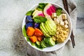 Quinoa salad with tofu, avocado and vegetables in white bowl, top view. Vegan breakfast Royalty Free Stock Photo