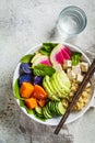 Quinoa salad with tofu, avocado and vegetables in white bowl, top view. Vegan breakfast Royalty Free Stock Photo