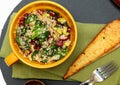 Quinoa Spinach Cranberry Salad and Garlic Toast on Table. Royalty Free Stock Photo