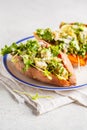 Quinoa Stuffed Sweet Potatoes with Kale and avocado. Royalty Free Stock Photo