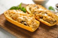 Quinoa stuffed zucchini boats on board, closeup Royalty Free Stock Photo