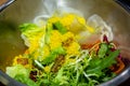 Quinoa Tabouleh salad in a bowl sitting on a wooden table