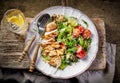 Quinoa and vegetable salad and grilled chicken