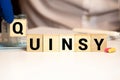 quinsy word on wooden cubes. quinsy concept. medical concept