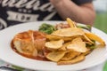 A typical dish consisting of a meat burger and Azorean cheese in Ponta Delgada on the island of Sao Miguel in th Royalty Free Stock Photo