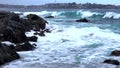 Quintay, Chile rocky coast battered by waves - low angle