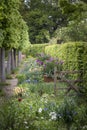 Quintessential vibrant English country garden scene landscape wi Royalty Free Stock Photo