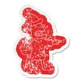quirky cartoon distressed sticker of a goblin with knife wearing santa hat