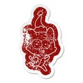 quirky cartoon distressed sticker of a surprised cat running wearing santa hat
