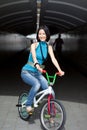 Quirky, funky chinese woman on street bike