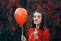 Woman Holding Paper Mustache Party Accessory and Red balloon