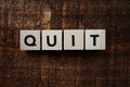 Quit alphabet letter on wooden background