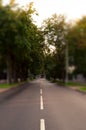 Quite city street in tilt shift technique. Alone car far side Royalty Free Stock Photo