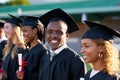 This is quite a special moment for all of us. Portrait of a university student standing amongst his classmates on