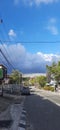 A quite street view in the middle of city with a cloudy sky. Royalty Free Stock Photo