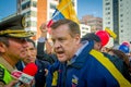 Quito, Ecuador - April 7, 2016: Closeup opposition leader Andres Paez sorrounded by people, police and journalists during anti gov